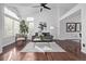 Bright living room with hardwood floors, large windows, vaulted ceiling and stylish decor at 7586 Halleys Dr, Littleton, CO 80125