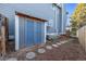 Backyard featuring a shed with mature trees offering shade and privacy at 7586 Halleys Dr, Littleton, CO 80125