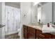 Bathroom featuring a granite vanity, shower with a decorative curtain, and tile floors at 27029 E Irish Pl, Aurora, CO 80016