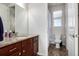 Bathroom featuring a granite vanity, tiled floors, and a shower with a window at 27029 E Irish Pl, Aurora, CO 80016