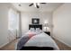 Bedroom with a ceiling fan, neutral walls, and a comfortable bed with stylish decor at 27029 E Irish Pl, Aurora, CO 80016