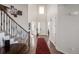 Bright, two-story foyer boasts an eye-catching staircase, high ceilings and natural light at 27029 E Irish Pl, Aurora, CO 80016