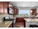 Well-equipped kitchen featuring granite counters, stainless appliances, and a gas cooktop stove at 27029 E Irish Pl, Aurora, CO 80016