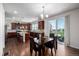 Spacious kitchen flowing into the dining area, highlighted by sleek cabinetry and natural light at 27029 E Irish Pl, Aurora, CO 80016