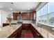 Stylish kitchen featuring granite counters, stainless appliances, and ample cabinet space at 27029 E Irish Pl, Aurora, CO 80016