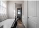 Hallway leading into an office, featuring a modern desk and neutral walls at 27029 E Irish Pl, Aurora, CO 80016