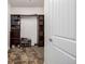 A walk-in closet has wood shelving and storage for organization at 27029 E Irish Pl, Aurora, CO 80016