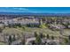Scenic aerial view of a neighborhood, highlighting its proximity to shopping centers and recreational areas with mountain views at 7444 S Milwaukee Ct, Centennial, CO 80122