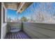 Private balcony with views of the neighborhood trees and blue skies, perfect for relaxing outdoors at 7444 S Milwaukee Ct, Centennial, CO 80122