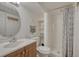 Bathroom featuring a single vanity, a shower, and a toilet for convenience at 7444 S Milwaukee Ct, Centennial, CO 80122