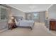 Spacious primary bedroom featuring neutral paint, plush carpet, and an abundance of natural light at 7444 S Milwaukee Ct, Centennial, CO 80122