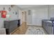 Well-decorated Bedroom with a crib, dresser, and a whimsical mountain themed accent wall at 7444 S Milwaukee Ct, Centennial, CO 80122