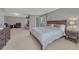 Bright bedroom with sitting area, fireplace and walk-out to the balcony, perfect for relaxing at 7444 S Milwaukee Ct, Centennial, CO 80122