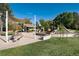 Community playground featuring play structures, picnic tables, and a covered area, perfect for Gathering gatherings and outdoor fun at 7444 S Milwaukee Ct, Centennial, CO 80122