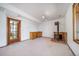 Cozy basement space features a wood-burning stove, wet bar, and ample room for activities at 6601 Pike Cir, Larkspur, CO 80118