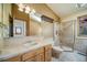 Bathroom with glass shower, sink, and views at 6601 Pike Cir, Larkspur, CO 80118