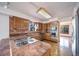 Kitchen features wood cabinets, stone countertops, and stainless steel appliances at 6601 Pike Cir, Larkspur, CO 80118