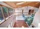Bright, open living room featuring a vaulted wood ceiling and abundant natural light at 6601 Pike Cir, Larkspur, CO 80118