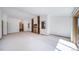 Large living room featuring built-in shelves, fireplace, and natural light at 6601 Pike Cir, Larkspur, CO 80118
