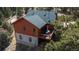 Aerial view of exterior showcasing large deck with outdoor seating area at 804 Clear Creek Rd, Evergreen, CO 80439