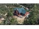 Aerial view of home's exterior, surrounding greenery, and outdoor seating area at 804 Clear Creek Rd, Evergreen, CO 80439