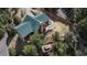 Aerial view of the house's roof, deck, yard, and outdoor seating area at 804 Clear Creek Rd, Evergreen, CO 80439