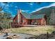 Home with outdoor furniture and mountain views at 804 Clear Creek Rd, Evergreen, CO 80439