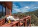 Outdoor deck with comfortable seating and stunning views of the surrounding mountains at 804 Clear Creek Rd, Evergreen, CO 80439