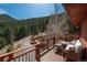 Relaxing outdoor deck featuring comfortable seating with scenic views at 804 Clear Creek Rd, Evergreen, CO 80439
