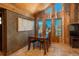 Dining area with wood table, chairs, and views of the surrounding landscape at 804 Clear Creek Rd, Evergreen, CO 80439