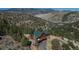 Exterior shot showcasing mountain views and home exterior at 804 Clear Creek Rd, Evergreen, CO 80439