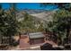Deck featuring an outdoor hot tub with panoramic mountain views at 804 Clear Creek Rd, Evergreen, CO 80439