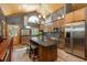 Well-appointed kitchen with center island, stainless steel appliances, and custom cabinetry at 804 Clear Creek Rd, Evergreen, CO 80439