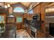 Gourmet kitchen featuring countertops, custom cabinets, and stainless steel appliances at 804 Clear Creek Rd, Evergreen, CO 80439