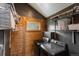 A functional laundry room featuring a washer, dryer, storage shelves and a window for natural light at 804 Clear Creek Rd, Evergreen, CO 80439