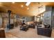 Spacious living room featuring a cozy fireplace and comfortable seating arrangement at 804 Clear Creek Rd, Evergreen, CO 80439