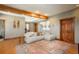 Comfortable living room features wood accents, area rug, and plentiful seating at 804 Clear Creek Rd, Evergreen, CO 80439