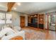 Bright living room with wood accents, a comfortable sofa, access to the outside, and mountain views at 804 Clear Creek Rd, Evergreen, CO 80439