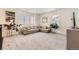 Spacious living area with a comfortable sectional sofa and large windows at 6506 Barnstead Dr, Castle Pines, CO 80108
