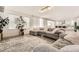 Open concept living room featuring a sectional sofa and access to the kitchen at 6506 Barnstead Dr, Castle Pines, CO 80108