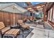 Backyard patio with comfortable seating under a pergola and string lights at 1218 S Josephine St, Denver, CO 80210