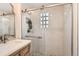 Modern bathroom featuring a glass-enclosed shower with unique tile work and a stylish vanity at 1218 S Josephine St, Denver, CO 80210