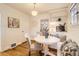 Bright dining nook featuring built-in seating, hardwood floors, and contemporary decor at 1218 S Josephine St, Denver, CO 80210