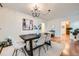 Elegant dining room with hardwood floors, a modern chandelier, and seating for six at 1218 S Josephine St, Denver, CO 80210
