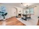 Dining room featuring a fireplace, hardwood floors, and a modern chandelier at 1218 S Josephine St, Denver, CO 80210