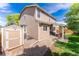 Cozy backyard featuring a covered patio, storage shed, and well-maintained landscaping at 13180 Jasmine St, Thornton, CO 80602
