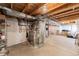 Unfinished basement with exposed pipes, and ductwork, plus an air conditioning unit at 13180 Jasmine St, Thornton, CO 80602
