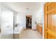 Primary bathroom featuring a bathtub, tiled floors, granite counter tops, and a walk-in closet at 13180 Jasmine St, Thornton, CO 80602