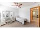 Carpeted bedroom with a ceiling fan and a large window at 13180 Jasmine St, Thornton, CO 80602