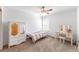 Bedroom with carpet, closet, vanity with stool, window, and decor at 13180 Jasmine St, Thornton, CO 80602
